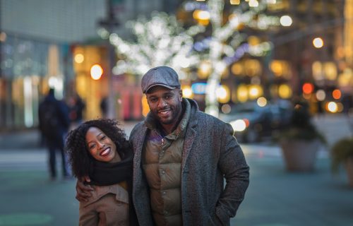 Portrait of couple in city at night, New York, USA