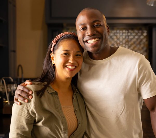 smiling-multiracial-couple-standing-together-in-ki-2024-09-18-18-37-20-utc (1)