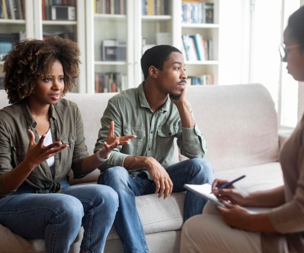 young-black-woman-sharing-thoughts-with-psychologist-family-session_116547-43655