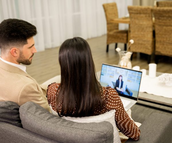 young-couple-having-online-consultation-with-famil-2023-11-27-05-08-08-utc